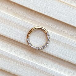 Clicker de titanio con baño de oro 24 Kt. y zirconias frontales