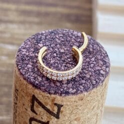 Alternative view of Clicker de titanio con baño de oro y 2 hileras de zirconias