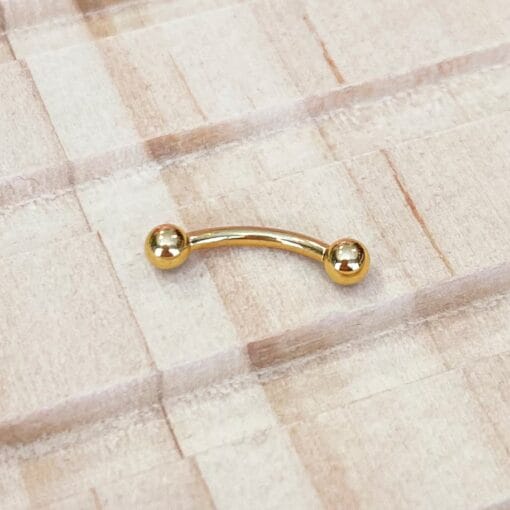 Banana de titanio con baño de oro y rosca 0,8 mm