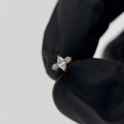 Top de titanio, baño de oro y 3 zirconias